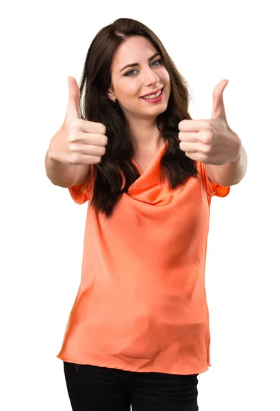 Beautiful young girl with thumb up — Stock Photo, Image