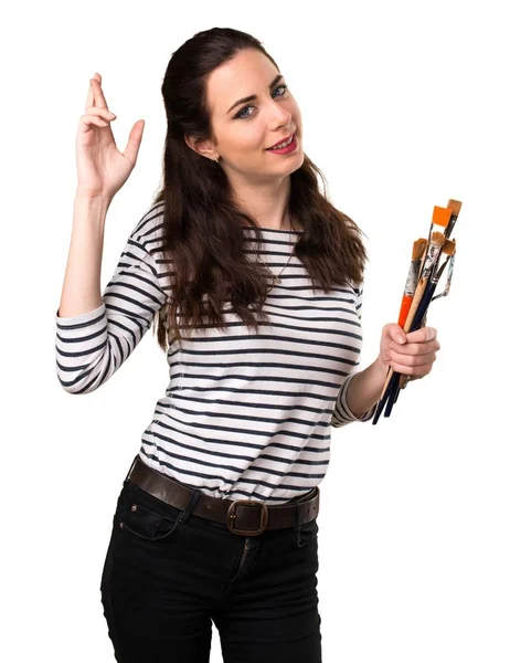 Young artist woman with her fingers crossing — Stock Photo, Image
