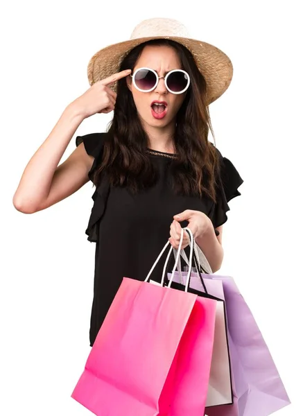 Gyönyörű fiatal lány bevásárló táska, ami őrült gesztus — Stock Fotó