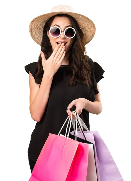 Beautiful young girl  with shopping bag making surprise gesture — Stock Photo, Image