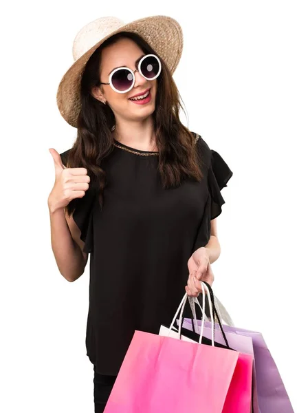 Menina bonita com saco de compras com polegar para cima — Fotografia de Stock