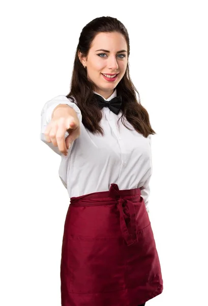 Young beautiful waitress pointing to the front — Stock Photo, Image