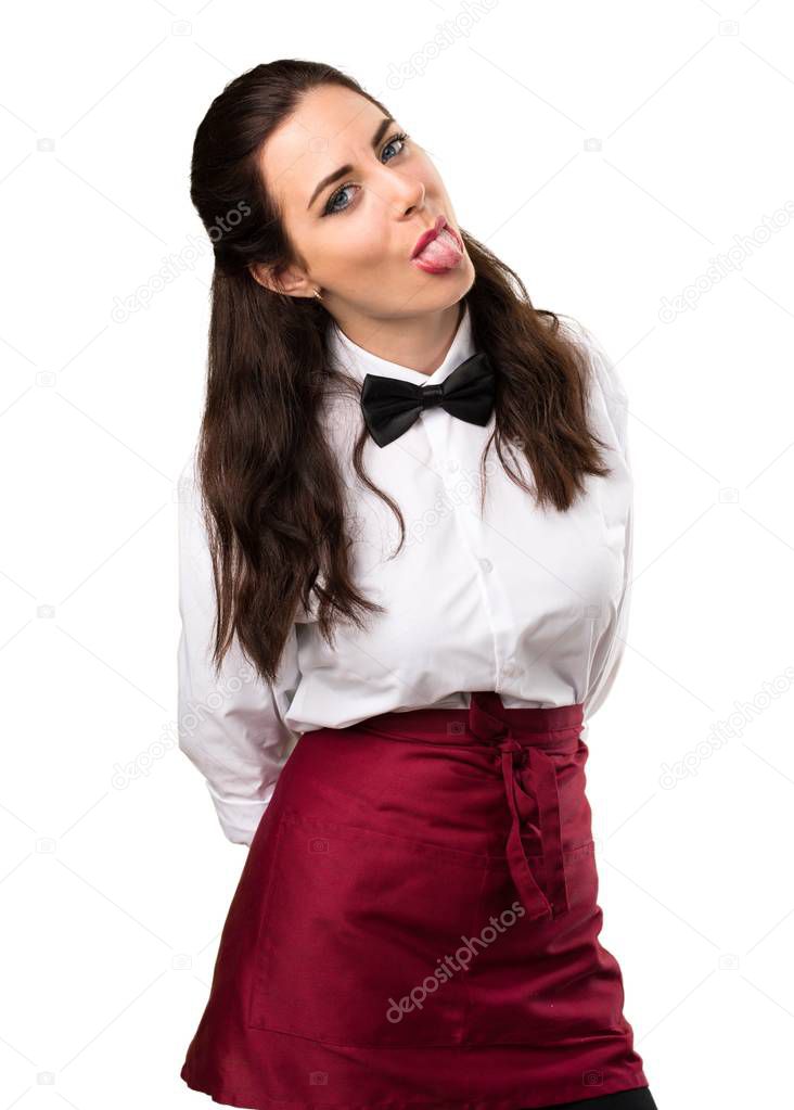 Young beautiful waitress taking out her tongue