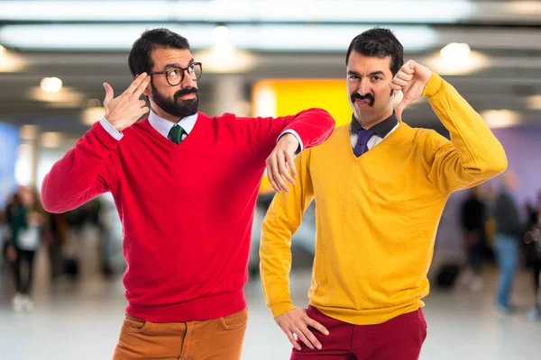 Man with moustache doing bad signal — Stock Photo, Image