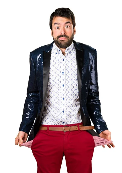 Yıkık adamla ceket ceplerinde para arıyor