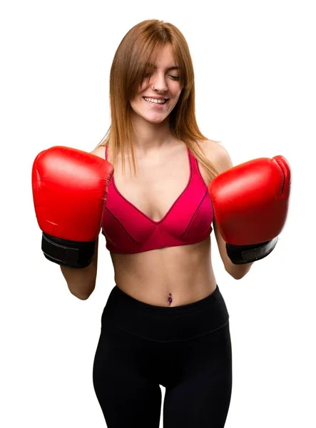 Jovem mulher esportiva com luvas de boxe — Fotografia de Stock