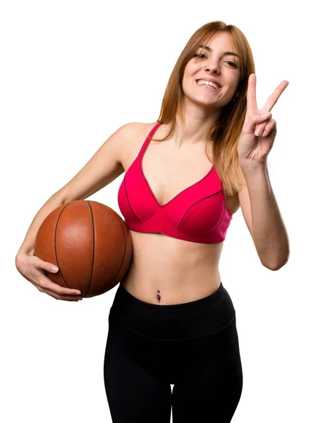 Jonge sport vrouw met bal van basketbal — Stockfoto