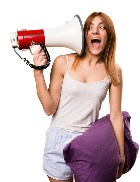 Beautiful girl in pajamas holding a megaphone — Stock Photo, Image