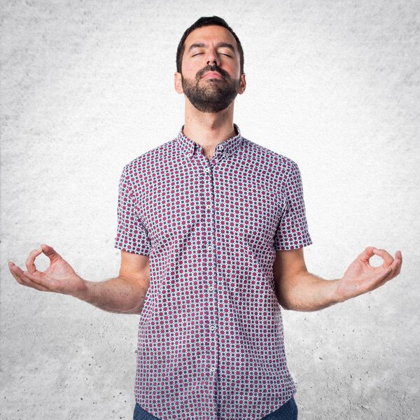 Handsome man in zen position