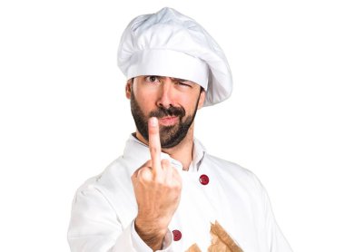 Biraz ekmek tutarak ve boynuz jest yapma genç baker