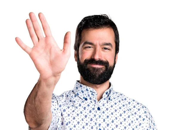 Hombre guapo morena con barba saludando — Foto de Stock