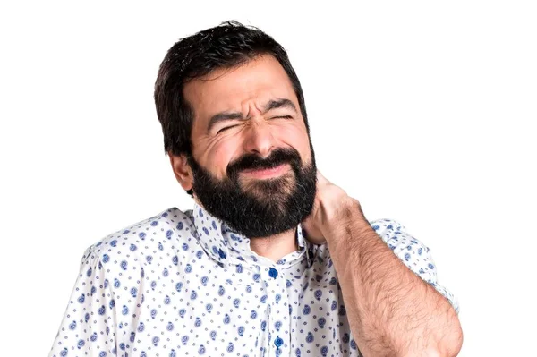 Przystojny mężczyzna brunetka z brodą z bólem karku — Zdjęcie stockowe