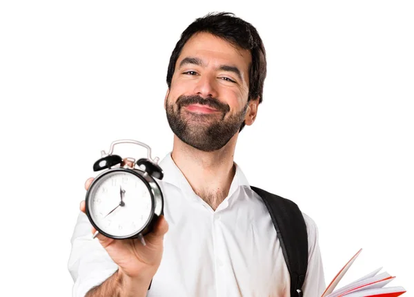 Studenta muž, který držel vintage hodiny — Stock fotografie