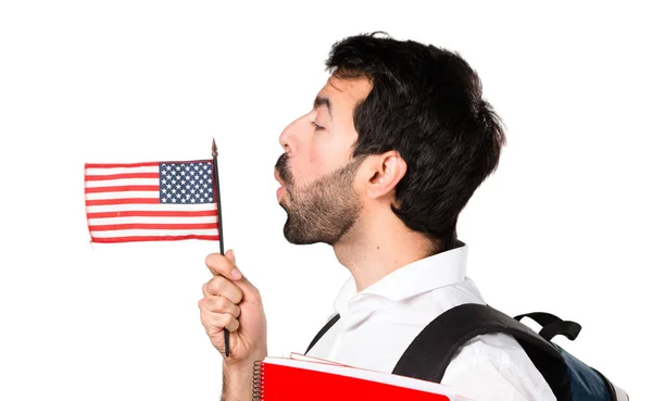 Studenta muž drží Americká vlajka — Stock fotografie