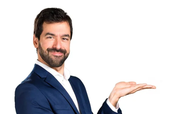 Handsome man presenting something — Stock Photo, Image