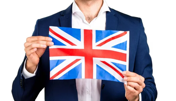 Beau homme tenant un drapeau britannique — Photo