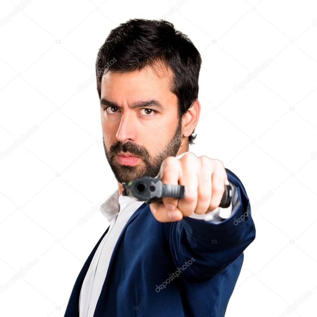 Handsome man holding a pistol