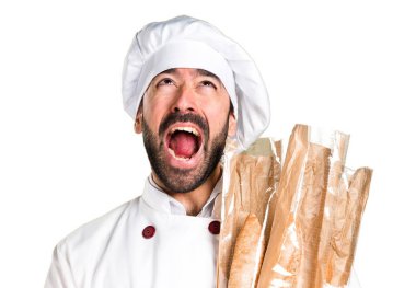 Biraz ekmek tutan ve bağırarak genç baker