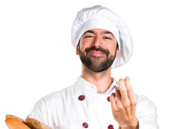 Genç baker önümüzdeki jest yapmak biraz ekmek tutan