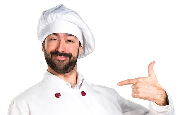 Joven panadero sosteniendo un poco de pan orgulloso de sí mismo — Foto de Stock