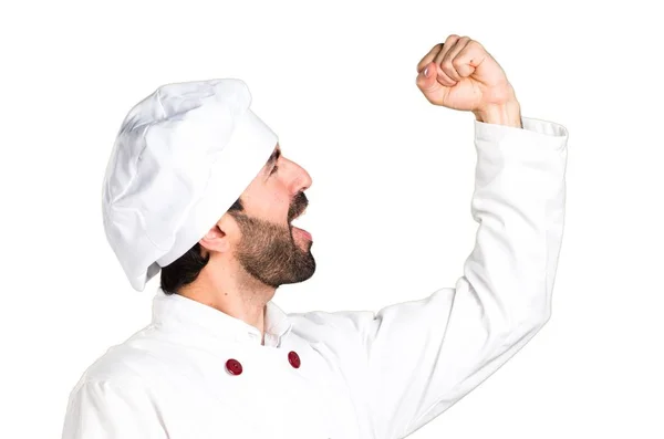 Lucky young baker holding some bread — Stock Photo, Image