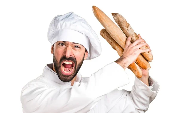 Frustrerade unga bagare håller vissa bröd — Stockfoto