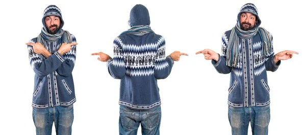 Zestaw człowieka z zimowych ubrań wskazując przykanalików, mając wątpliwości — Zdjęcie stockowe