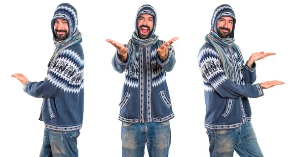 Set of Man with winter clothes presenting something — Stock Photo, Image