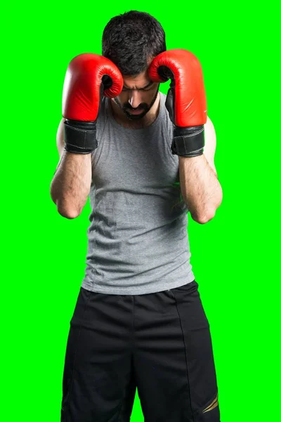 Desportista com luvas de boxe — Fotografia de Stock