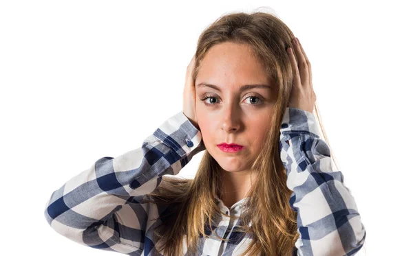 Blonde teen girl covering her ears — Stock Photo, Image