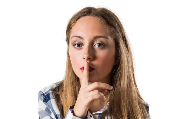 Blonde teen girl making silence gesture — Stock Photo, Image