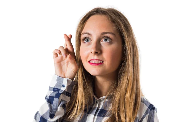 Rubia adolescente chica con sus dedos cruzando —  Fotos de Stock