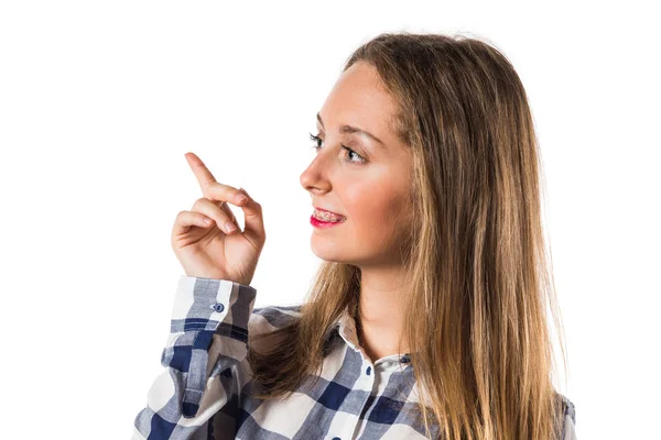 Blond tonåring flicka pekar uppåt — Stockfoto