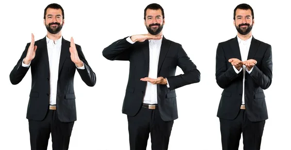 Conjunto de Bonito homem de negócios segurando algo — Fotografia de Stock