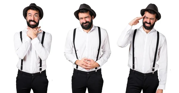 Hipster mannen med skägg med magont och huvudvärk — Stockfoto