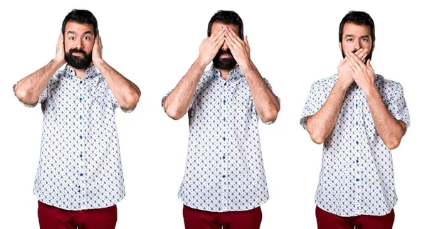 Onun gözleri, kulakları ve ağız kapsayan sakallı yakışıklı esmer adam