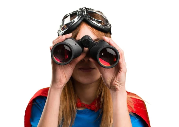 Pretty superhero girl with binoculars — Stock Photo, Image