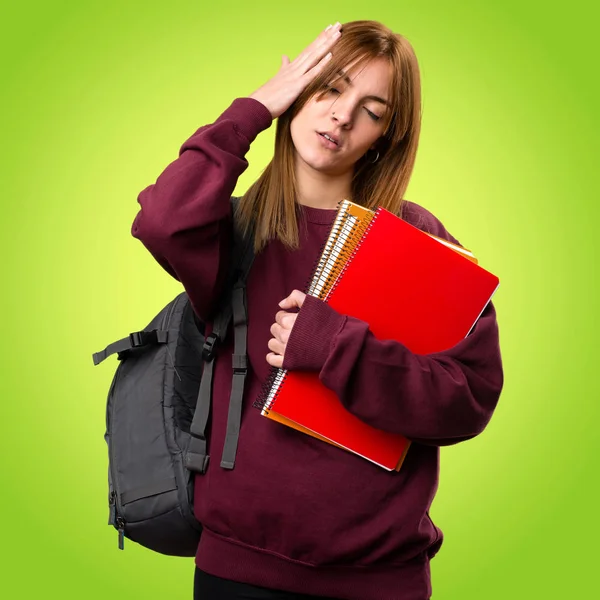 Mujer estudiante frustrado en fondo colorido —  Fotos de Stock