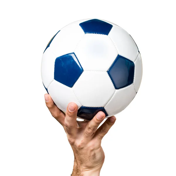 Mano del hombre sosteniendo una pelota de fútbol — Foto de Stock
