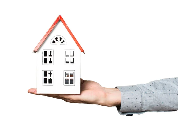 Hand of man holding a little house — Stock Photo, Image