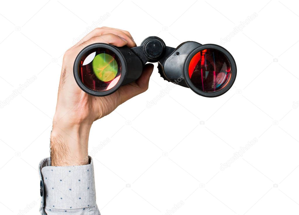 Hand of man holding with binoculars