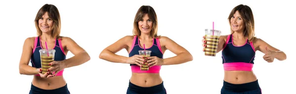 Athlete woman holding a sport drink — Stock Photo, Image