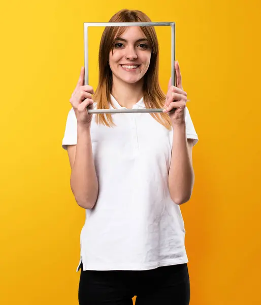 stock image Happy Beautiful young girl with framework on yellow background