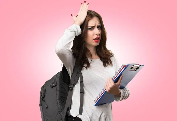 Student woman having doubts on colorful background — Stock Photo, Image