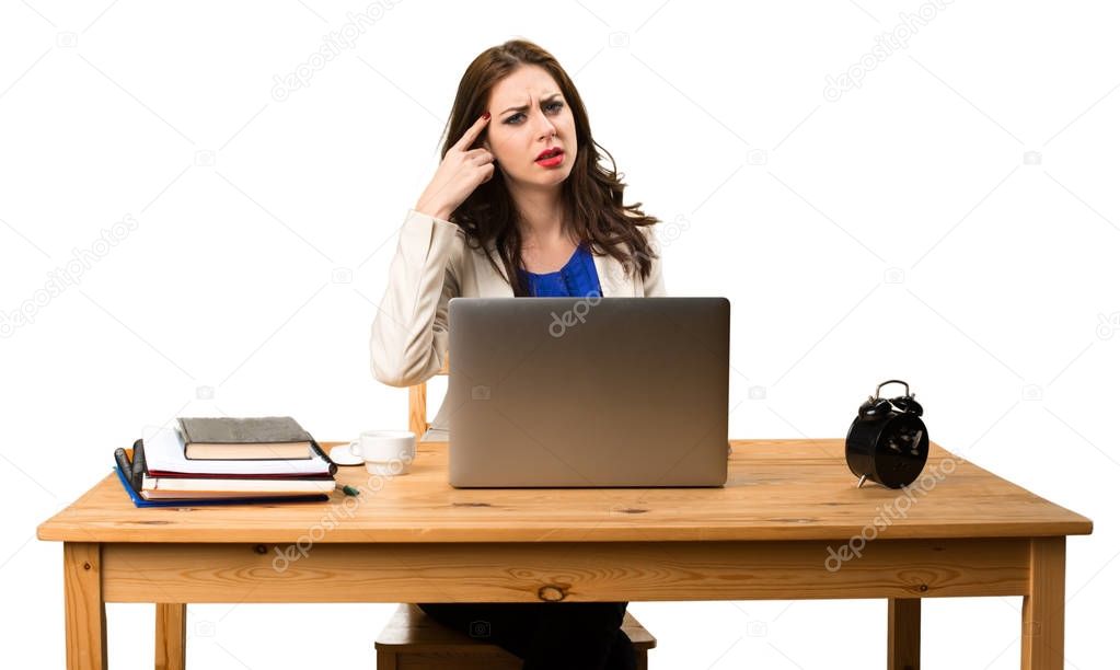 Business woman working with her laptop and making crazy gesture