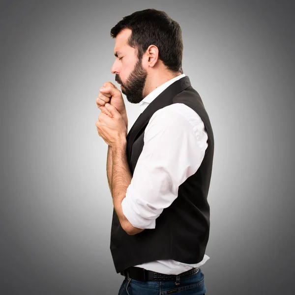 Cool man coughing a lot on grey background — Stock Photo, Image