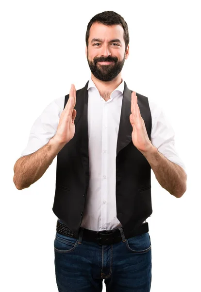 Cool man holding something on isolated white background — Stock Photo, Image