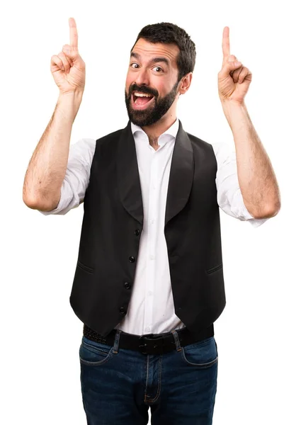 Hombre fresco apuntando hacia arriba en el fondo blanco aislado — Foto de Stock