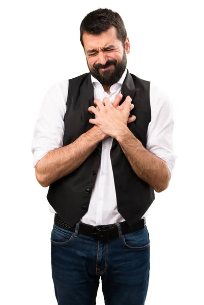 Cool man with heart pain on isolated white background — Stock Photo, Image