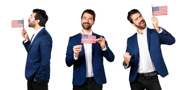 Pohledný muž drží Americká vlajka — Stock fotografie